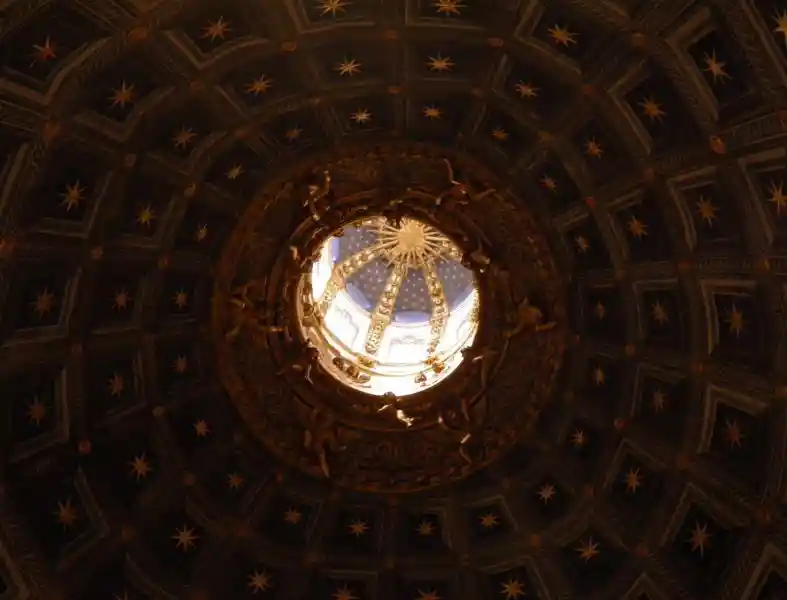 Stars in the form of a solar disc on the ceiling of Siena Cathedral